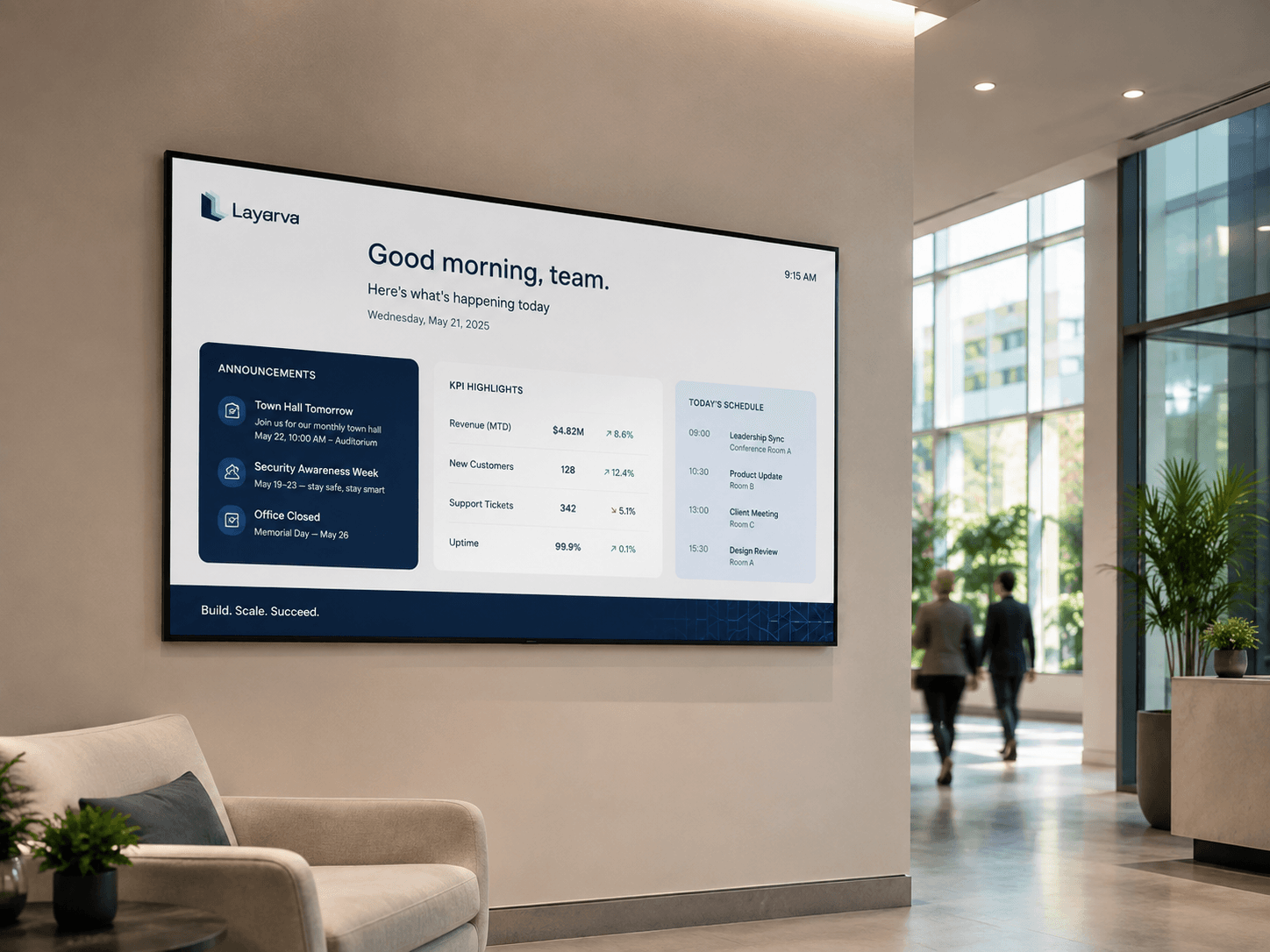 Corporate office lobby screen showing team announcements, KPIs, and schedule